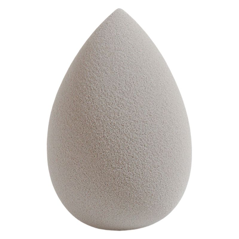 Esponja cosmética en forma de lágrima de color gris claro sofisticado diseñada para maquilladores profesionales. Espuma ultra suave y no absorbente que garantiza eficiencia en el producto. Suministro directo de fábrica con opciones de marca personalizada.
